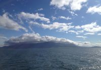 Clouds over the mountains leaving Reykjavik harbor